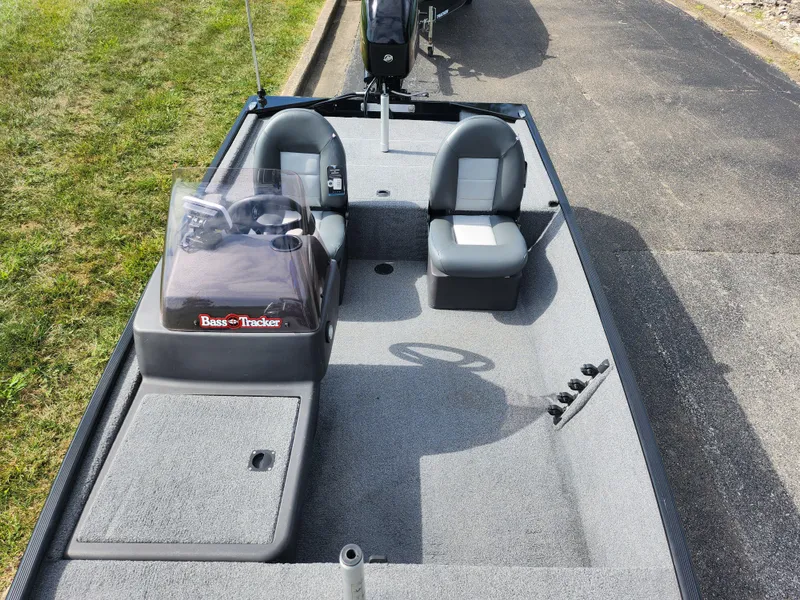 Slide: The Image of 2022 Tracker Bass Tracker Classic XL boat interior with seating and steering console. - 18