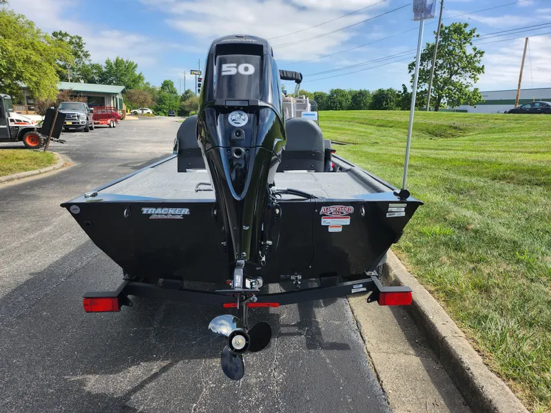 Slide: The Image of 2022 Tracker Bass Tracker Classic XL boat with 50 HP motor on a paved road. - 2