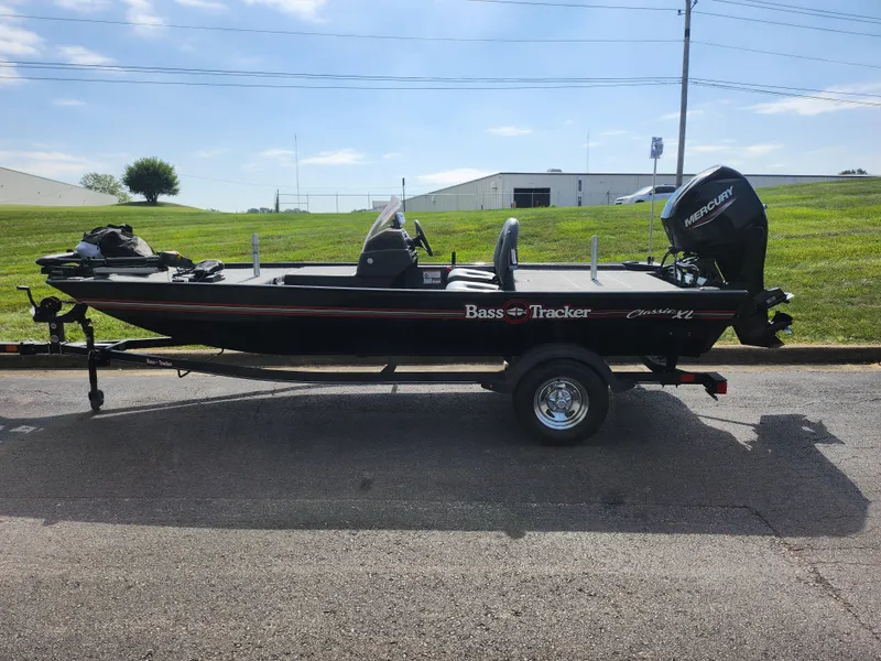 Slide: The Image of 2022 Tracker Bass Tracker Classic XL boat on trailer, parked outdoors. - 4