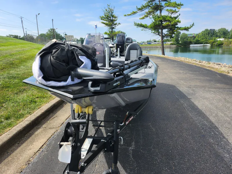 Slide: The Image of 2022 Tracker Bass Tracker Classic XL boat on trailer by a lake. - 7