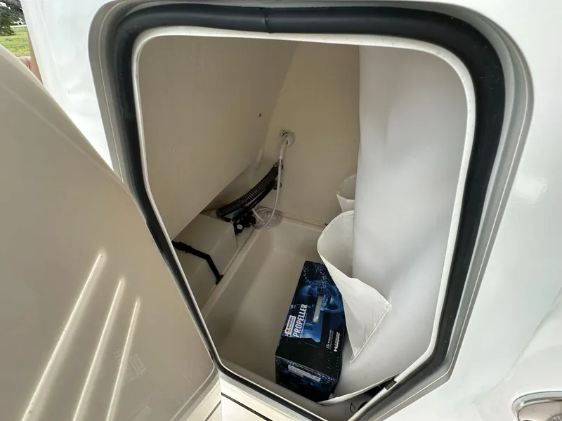 Slide: The Image of Storage compartment of 2025 Pioneer 202 Islander boat with propeller box. - 7