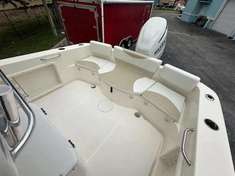 Slide: The Image of 2025 Bulls Bay 230 CC boat interior with seating and storage compartments. - 11