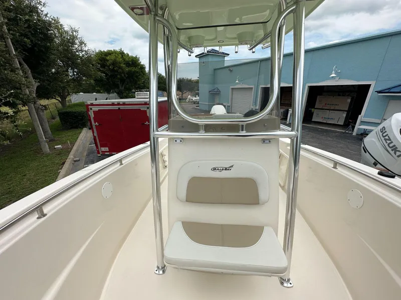 Slide: The Image of 2025 Bulls Bay 230 CC boat interior with T-top and seating. - 8