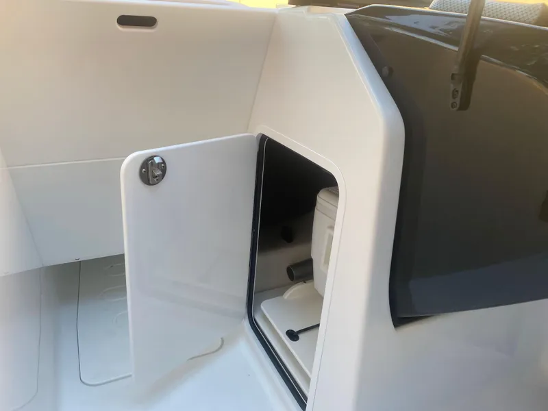 Slide: The Image of 2025 Scarab 255 ID boat interior with open storage compartment. - 11