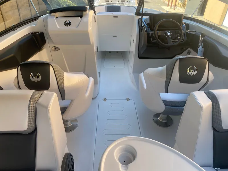 Slide: The Image of Interior of 2025 Scarab 255 ID boat with modern seating and steering console. - 12