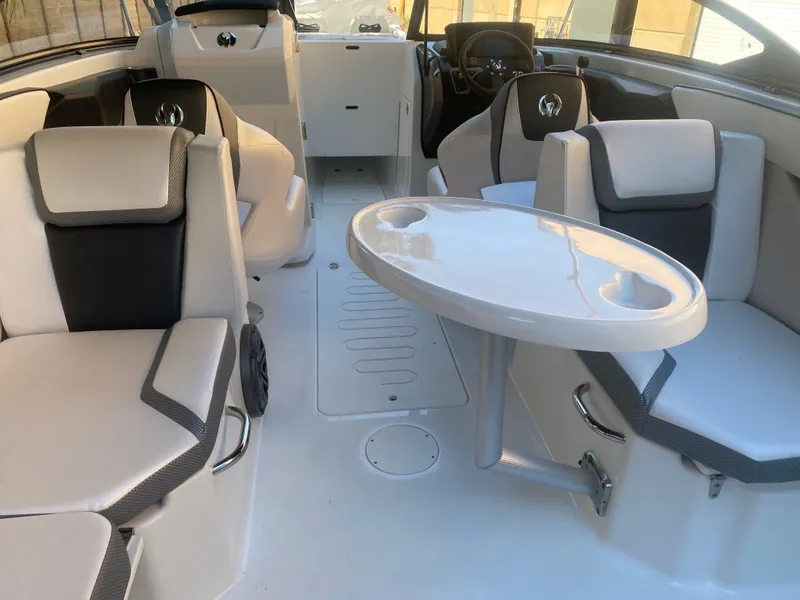 Slide: The Image of Luxurious interior of 2025 Scarab 255 ID boat with modern seating and table. - 18