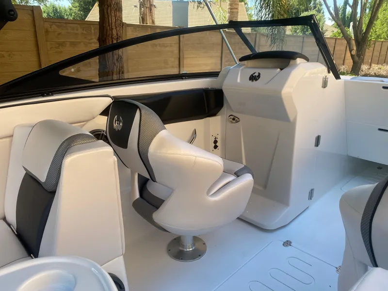 Slide: The Image of 2025 Scarab 255 ID boat interior with modern seating and sleek design. - 19