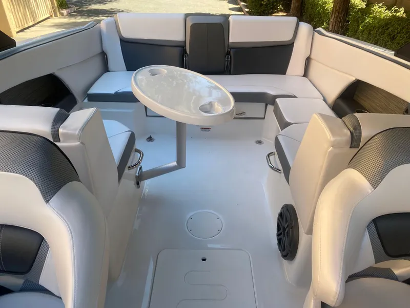 Slide: The Image of 2025 Scarab 255 ID boat interior with seating and table. - 21