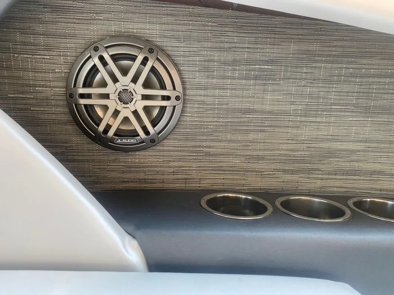 Slide: The Image of Speaker and cup holders in 2025 Scarab 255 ID boat interior. - 24