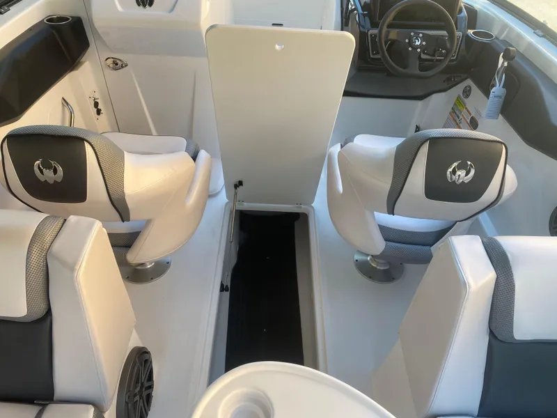 Slide: The Image of Interior of 2025 Scarab 255 ID boat with modern seating and dashboard. - 27