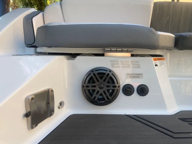Slide: The Image of 2025 Scarab 255 ID boat interior with speaker and seating detail. - 6