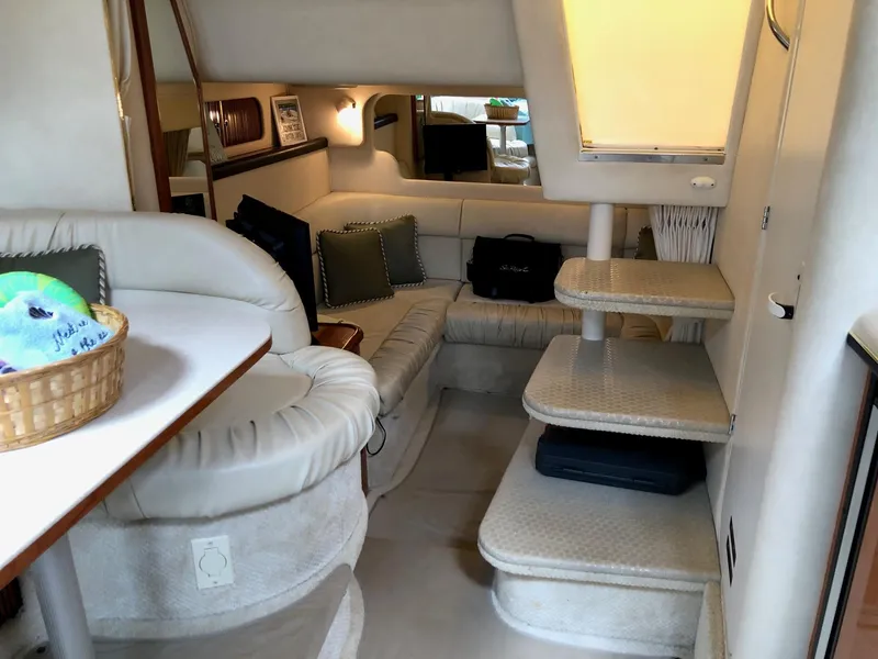 Slide: The Image of Interior of 2001 Sea Ray 340 Sundancer yacht with cozy seating and elegant design. - 23