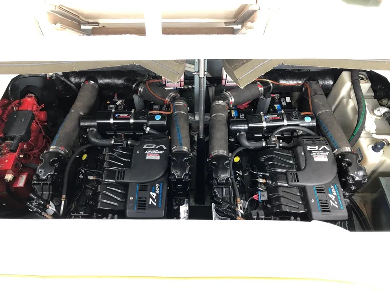 Slide: The Image of Twin engines of a 2001 Sea Ray 340 Sundancer boat. - 32