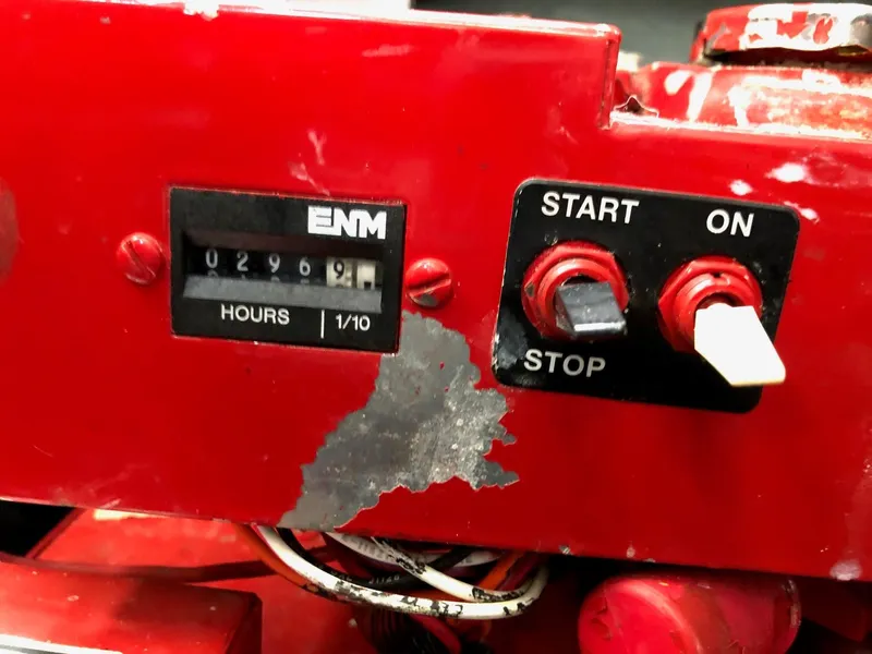 Slide: The Image of Red control panel with hour meter and start/stop switches, Sea Ray 340 Sundancer 2001. - 35