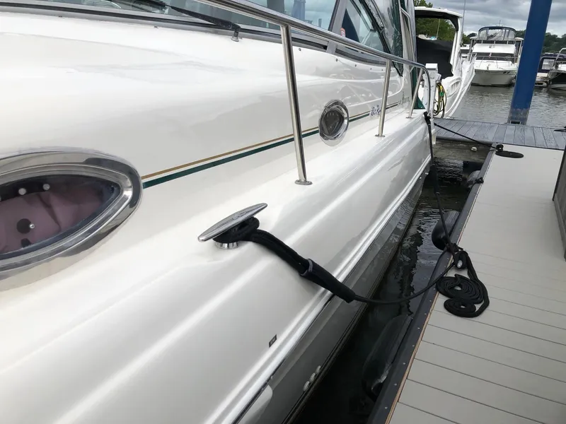 Slide: The Image of 2001 Sea Ray 340 Sundancer docked at marina, side view. - 4