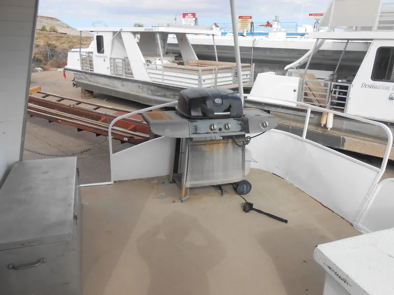 Slide: The Image of Outdoor grill on 1972 Boatel Hurcules houseboat deck, with other boats in the background. - 7