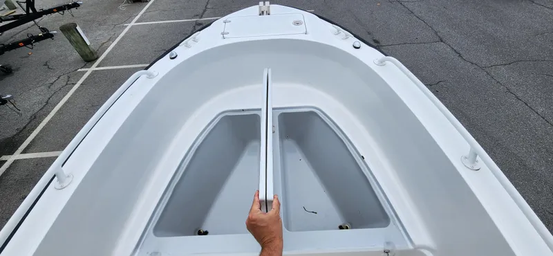 Slide: The Image of Boston Whaler Justice 24 boat bow, 2000 model, with open storage compartments. - 11