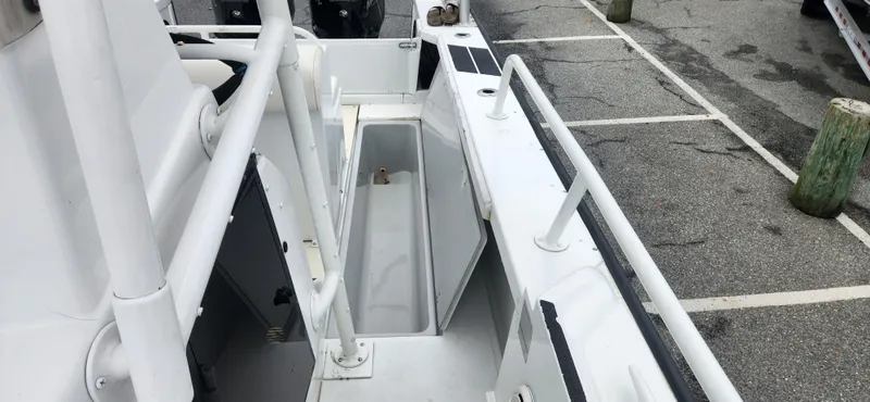 Slide: The Image of Boston Whaler Justice 24 boat interior, open storage compartment, docked, 2000 model. - 14