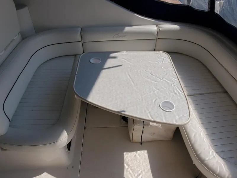 Slide: The Image of Interior seating area of 2000 Bayliner 3055 Ciera Sunbridge DX/LX with table. - 4
