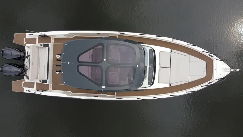 Slide: The Image of Aerial view of 2024 Navan S30 boat on water, showcasing sleek design and dual engines. - 11