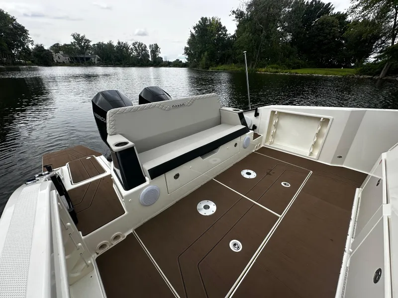 Slide: The Image of 2024 Navan S30 boat with dual engines on a serene lake. - 15