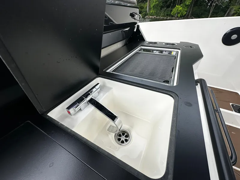 Slide: The Image of 2024 Navan S30 boat sink and grill area, featuring modern design and functionality. - 23