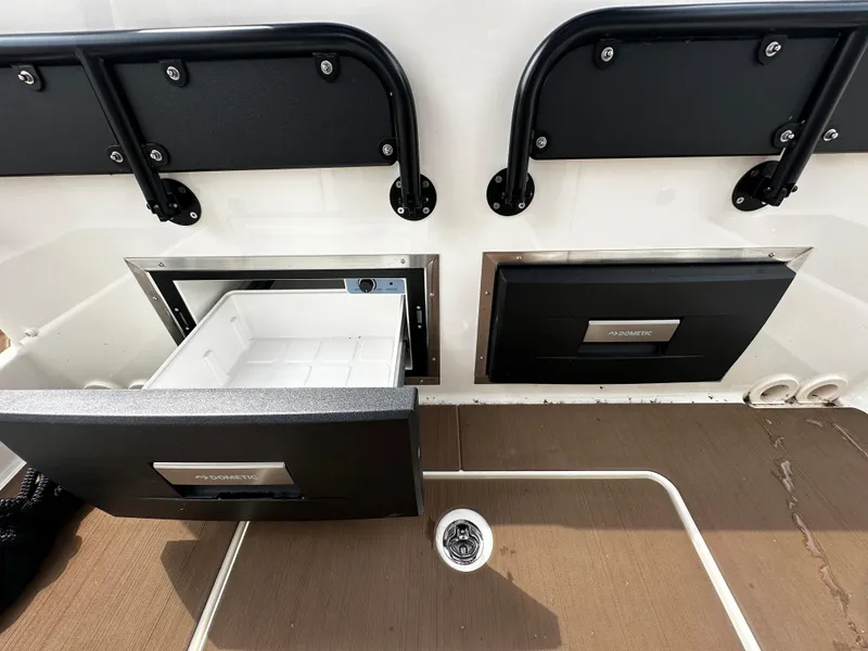 Slide: The Image of 2024 Navan S30 boat interior with open storage compartments and seating. - 24
