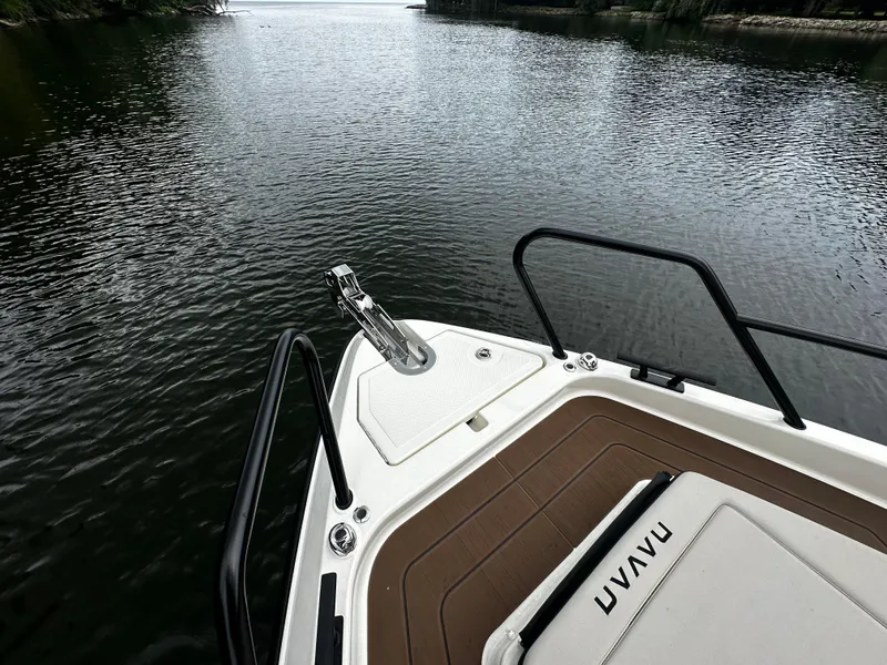 Slide: The Image of Bow of 2024 Navan S30 boat on calm water, featuring sleek design and modern railing. - 34