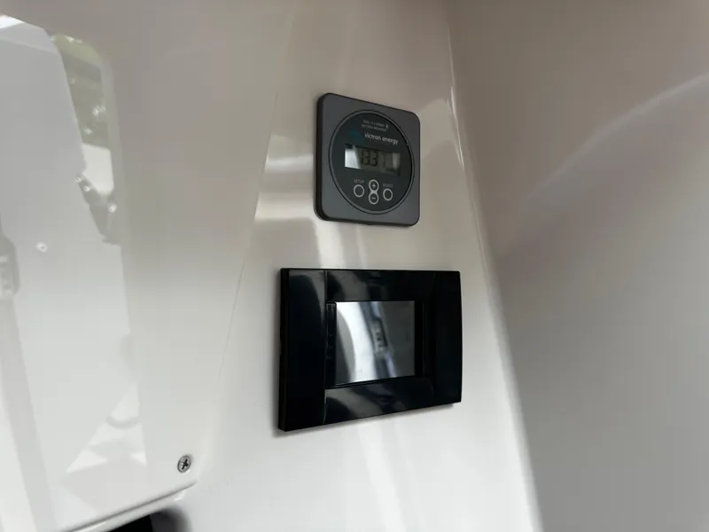 Slide: The Image of Control panel inside 2024 Navan S30, featuring digital display and sleek design. - 41