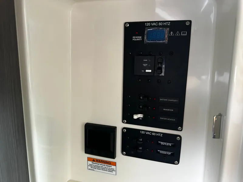 Slide: The Image of Electrical control panel in a 2024 Navan S30 vehicle, featuring 120 VAC 60 Hz settings. - 42