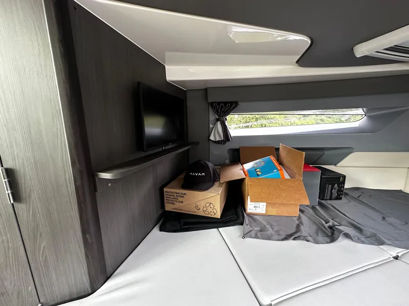 Slide: The Image of 2024 Navan S30 interior with boxes, TV, and modern design elements. - 44