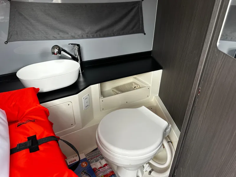 Slide: The Image of 2024 Navan S30 bathroom interior with sink, toilet, and storage. - 46