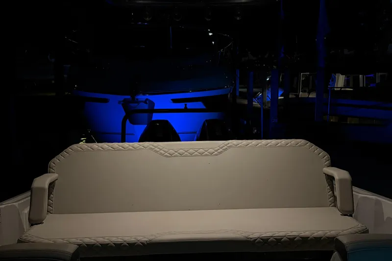 Slide: The Image of Luxurious Navan S30 boat interior with elegant seating, illuminated by ambient blue lighting. - 54