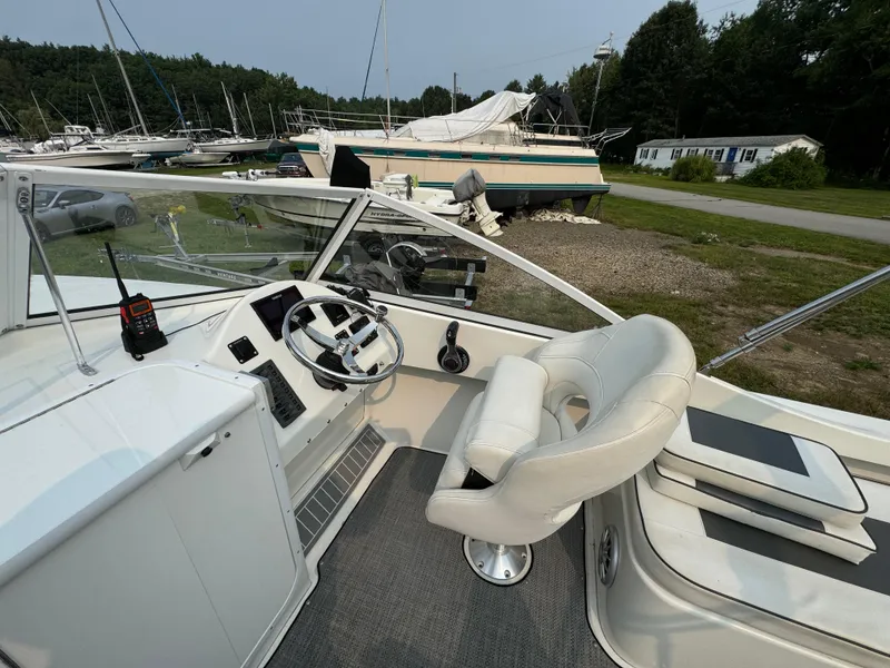 Slide: The Image of Cockpit of a 2019 Eastern 21 Pilot boat with steering wheel and seating. - 16