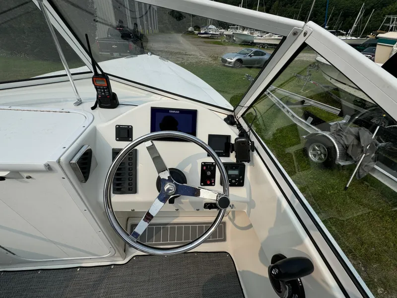Slide: The Image of Cockpit of a 2019 Eastern 21 Pilot boat with steering wheel and navigation equipment. - 17