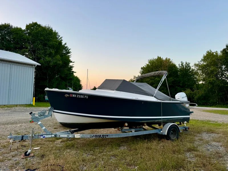 Slide: The Image of 2019 Eastern 21 Pilot boat on trailer, parked outdoors at sunset. - 23