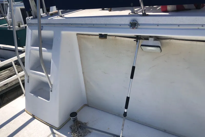 Slide: The Image of 1994 Gibson 50 Cabin Yacht deck with stairs and railing. - 10