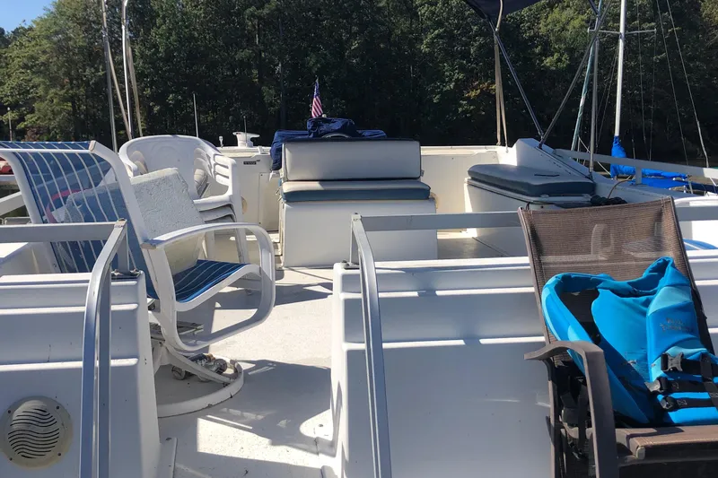 Slide: The Image of 1994 Gibson 50 Cabin Yacht deck with seating and outdoor furniture. - 13