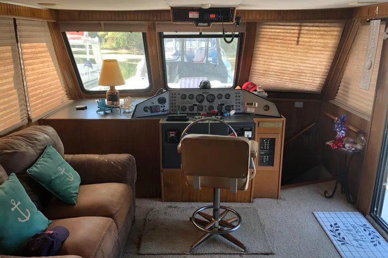 Slide: The Image of 1994 Gibson 50 Cabin Yacht interior with helm, seating, and nautical decor. - 25