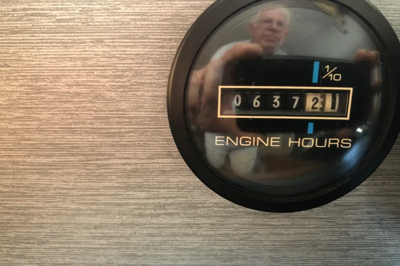Slide: The Image of Close-up of engine hours gauge on 1994 Gibson 50 Cabin Yacht, displaying 637.2 hours. - 27