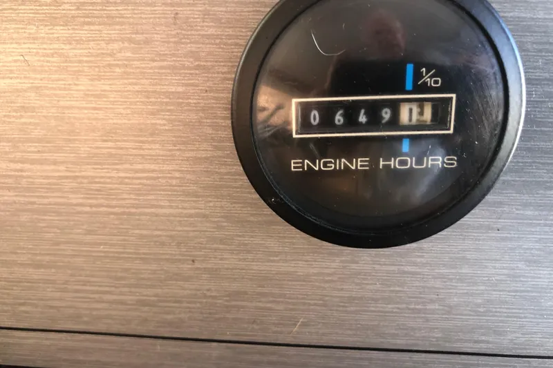 Slide: The Image of Engine hour meter showing 649.1 hours on 1994 Gibson 50 Cabin Yacht. - 28