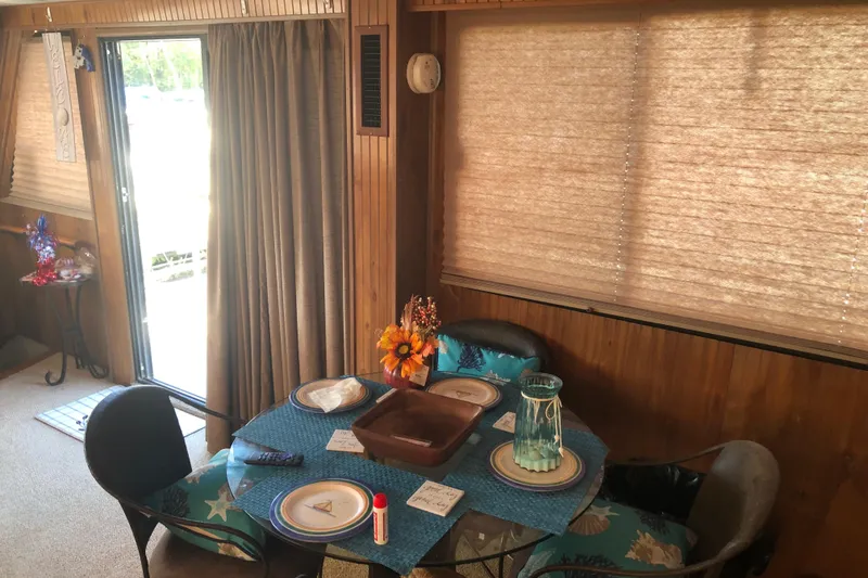Slide: The Image of Interior of 1994 Gibson 50 Cabin Yacht with dining table setup. - 29