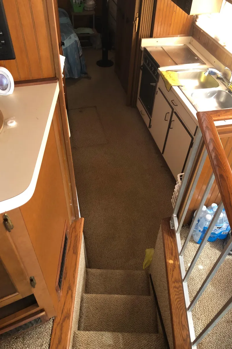 Slide: The Image of Interior of a 1994 Gibson 50 Cabin Yacht with kitchen and stairs. - 31