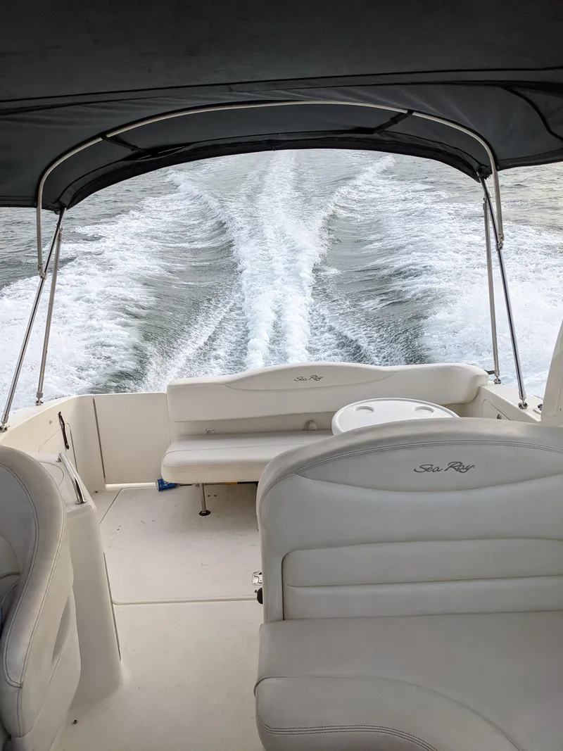 Slide: The Image of 2005 Sea Ray 280 Sundancer cruising on water, view from cockpit with wake trail. - 5