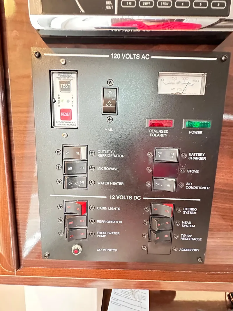 Slide: The Image of Electrical control panel on a 2015 Sea Ray 260 Sundancer boat. - 29