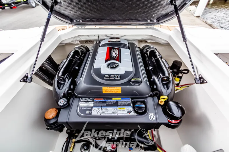 Slide: The Image of 2025 Chaparral 21 SSi boat engine compartment with Mercury 4.5L 250 HP engine. - 18