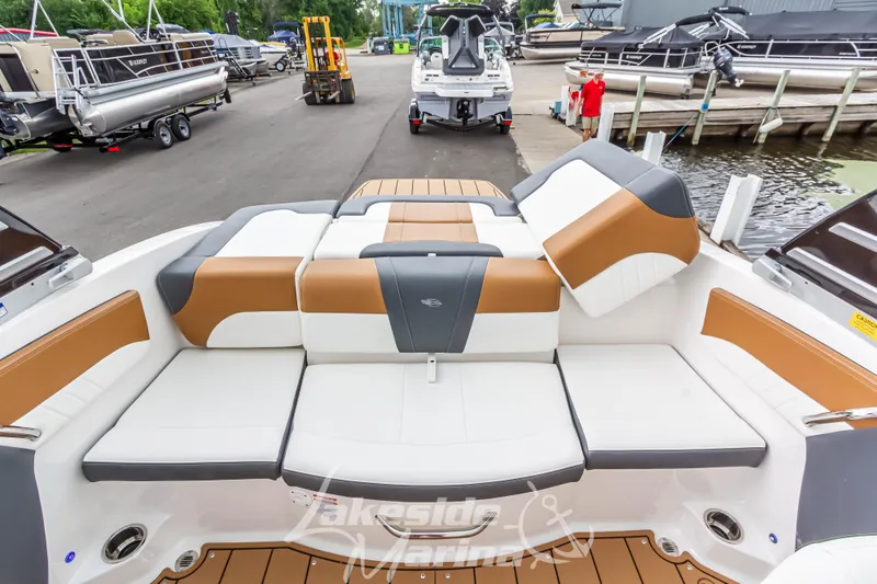 Slide: The Image of 2025 Chaparral 21 SSi boat interior with stylish seating at marina. - 20