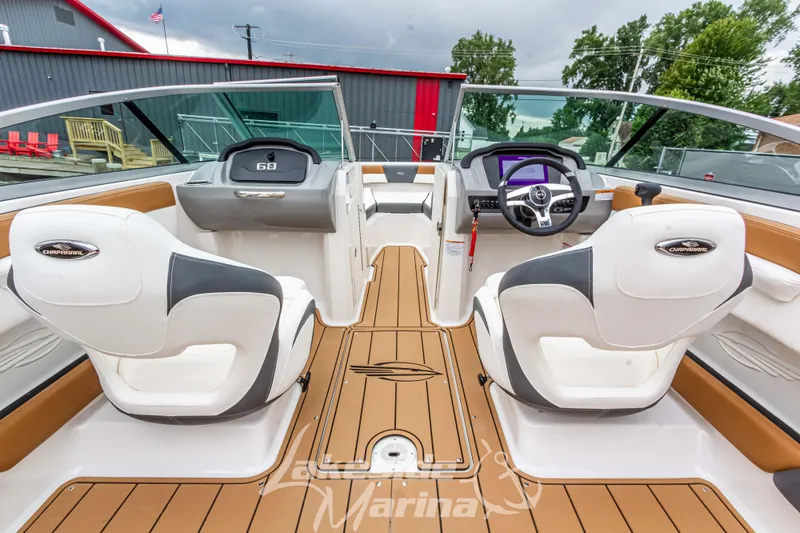 Slide: The Image of 2025 Chaparral 21 SSi boat interior with modern dashboard and seating. - 21