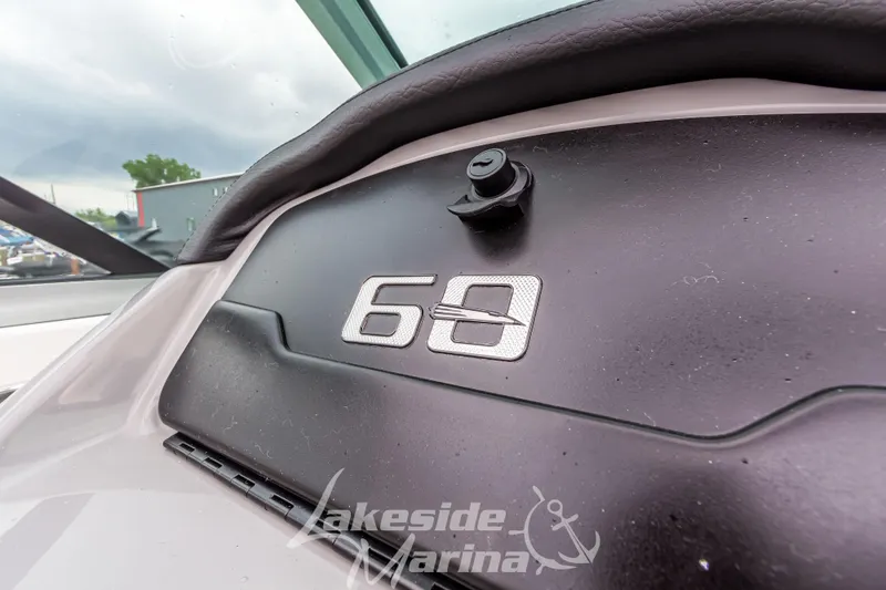 Slide: The Image of Close-up of 2025 Chaparral 21 SSi dashboard with "Lakeside Marina" logo. - 29