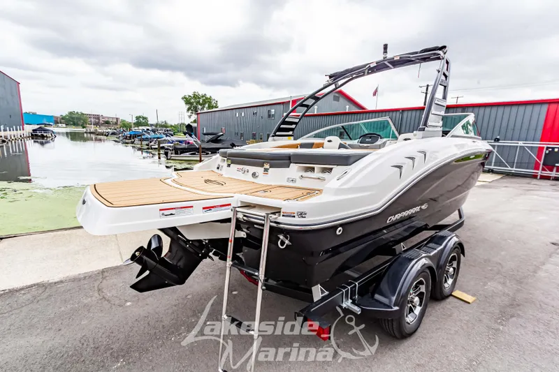 Slide: The Image of 2025 Chaparral 21 SSi boat on trailer at marina dockside. - 4